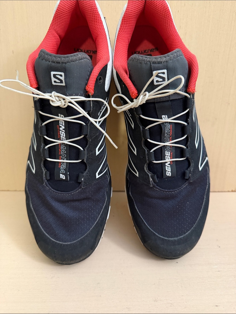 M9 Salomon black trail running shoes with red interior